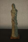 A bronze resin figure of a lady draped in cloth. H.56 W.14cm.