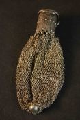 An early 20th century white metal mesh chatelaine purse with hinged cap to the top with an