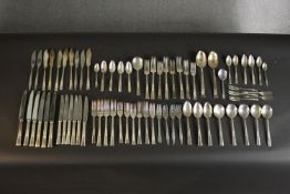 A large collection of Smith Seymour and other makers floral relief design silver plate cutlery. L.