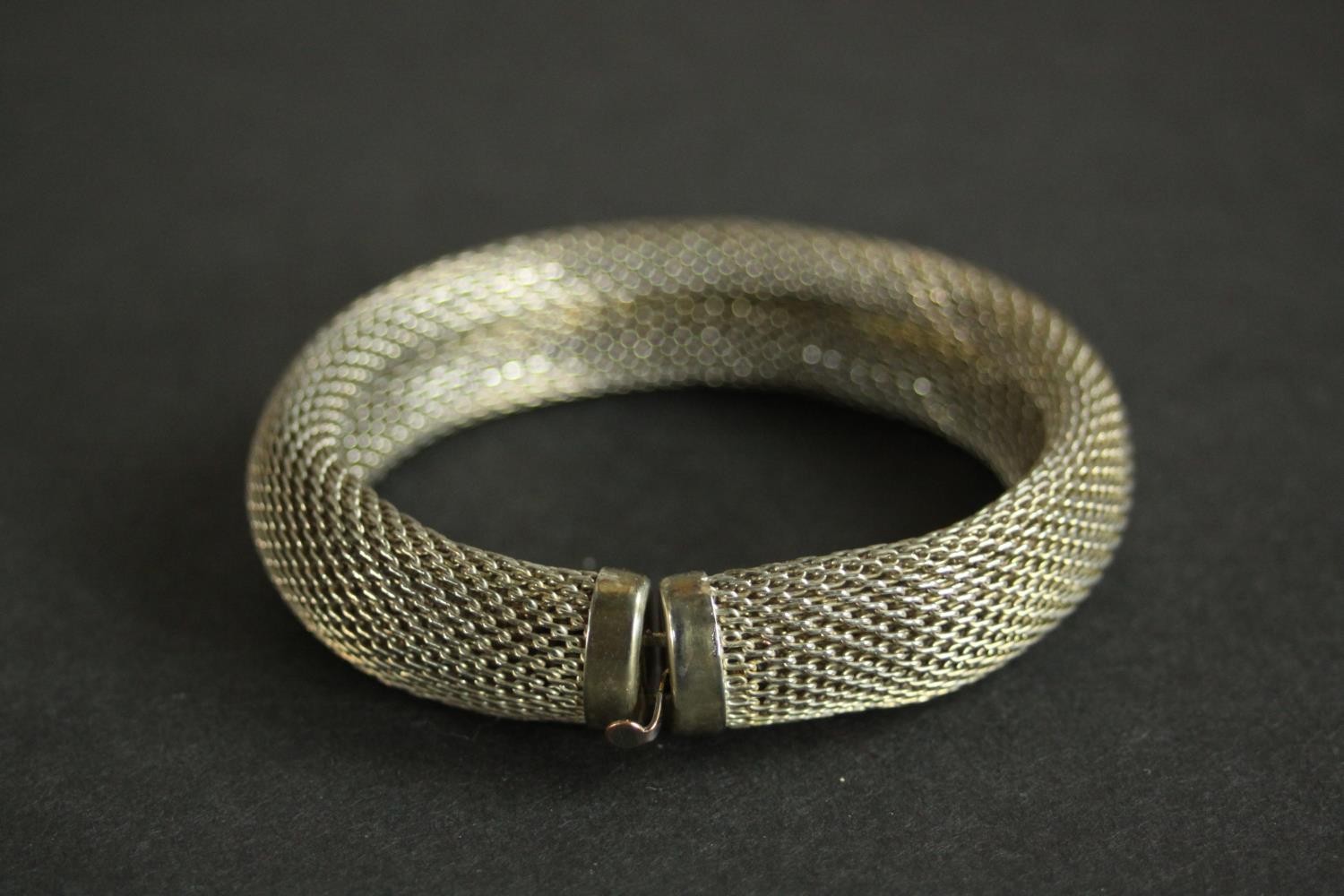 A collection of silver bangles, a silver bangle watch and a tortoiseshell and silver articulated - Image 3 of 9