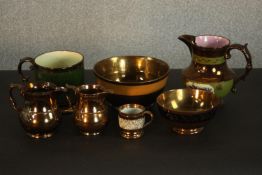 A collection of 19th century copper lustre items, comprising bowls, jugs and mugs. H.17 W.19 D.14cm.