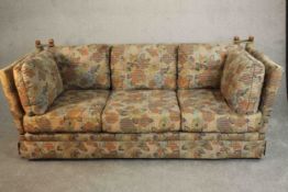 A late 20th century three seater Knole Heritage sofa, upholstered in polychrome foliate fabric. H.83
