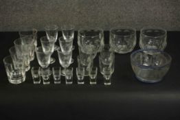 A collection of hand cut and engraved glass, including a Bohemian 19th century etched bowl, a set of