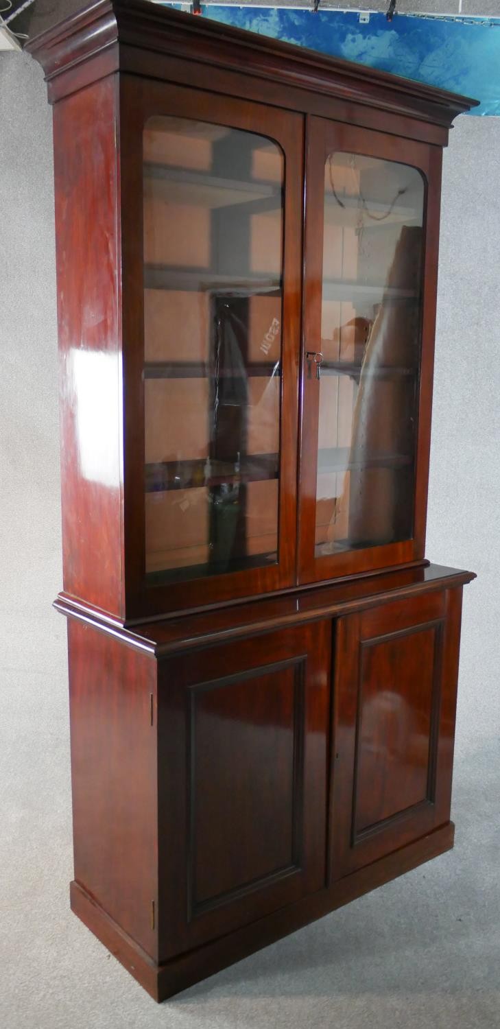 A late Victorian walnut bookcase with a pair of glazed doors enclosing adjustable shelves over a - Image 5 of 5