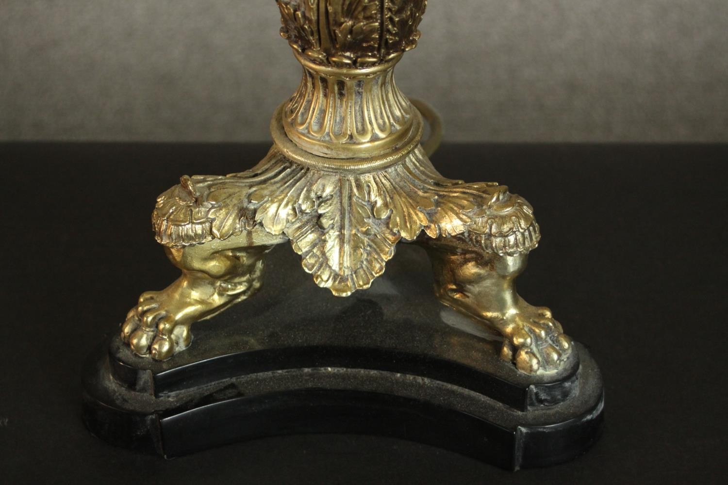 A 20th century brass table lamp of columnar form with a cast tri-form base with lion paw feet. H. - Image 3 of 5