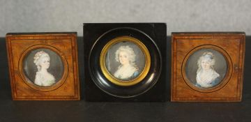 Three framed and glazed 19th century hand painted portrait miniatures of ladies in fine dress,