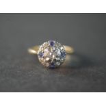 An 18 carat yellow gold and platinum Ceylon sapphire and old mine diamond Edwardian cluster ring.