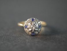 An 18 carat yellow gold and platinum Ceylon sapphire and old mine diamond Edwardian cluster ring.