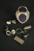 A collection of silver items, including a pair of silver cufflinks, a Douglas Pell money clip, a