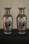 A pair of large hand painted 20th century Chinese vases decorated with flowers and figures. Mark