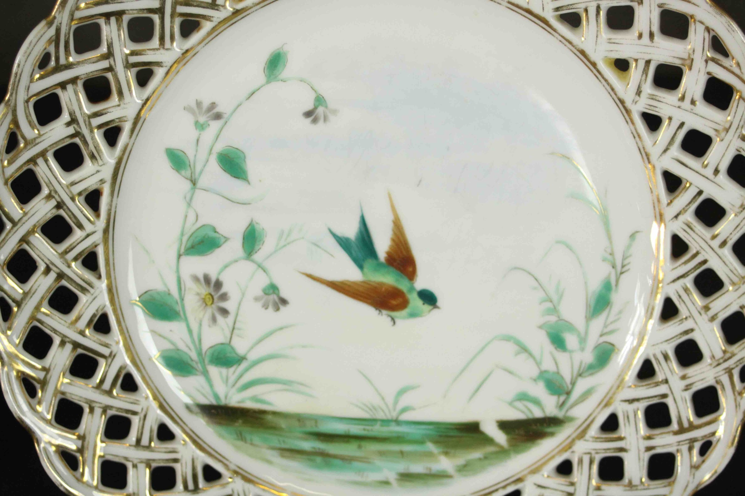 A set of eleven 19th century hand painted porcelain plates with pierced gilded lattice work rims and - Image 5 of 6