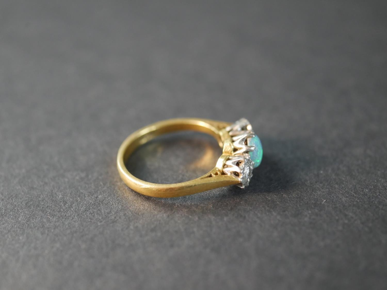 An 18 carat yellow gold and platinum Edwardian opal and diamond three stone ring, set to centre with - Image 4 of 5