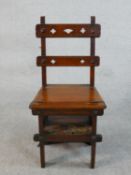 A Victorian walnut metamorphic library chair / steps, the bar back with pierced quatrefoils, the