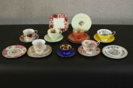 A collection of hand painted tea cups and saucers with various patterns and makers. H.40 W.15cm. (