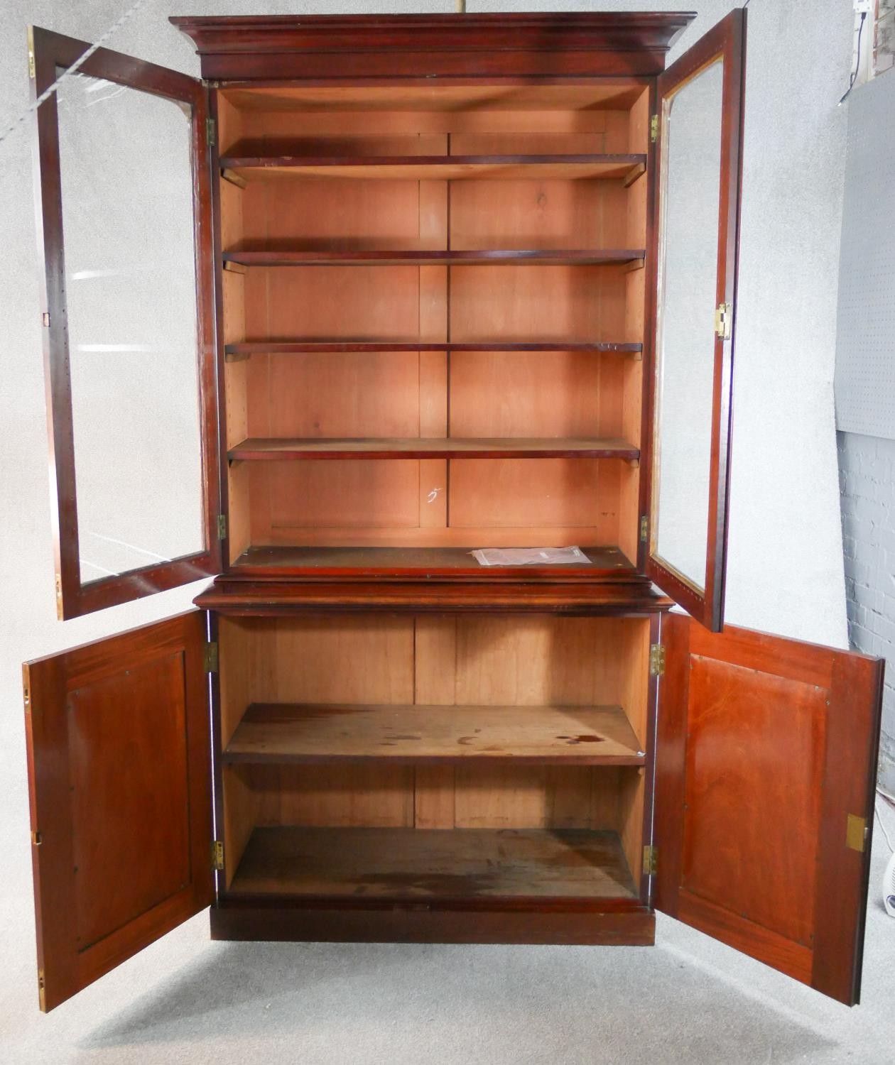 A late Victorian walnut bookcase with a pair of glazed doors enclosing adjustable shelves over a - Image 2 of 5