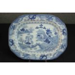 A 19th century blue and white transfer design ceramic Chinese willow pattern meat plate. Maker's