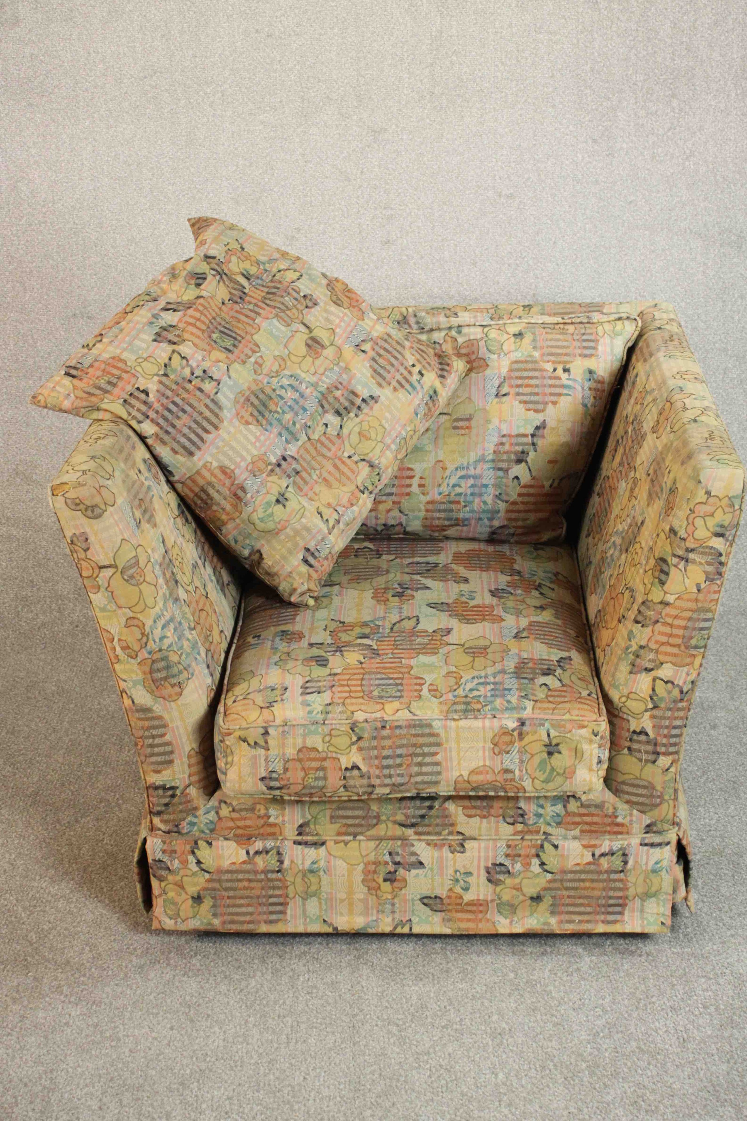 A late 20th century Knole style armchair, upholstered in polychrome foliate fabric. H.70 W.90 D.