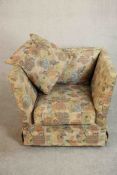 A late 20th century Knole style armchair, upholstered in polychrome foliate fabric. H.70 W.90 D.