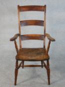A 19th century ladder back open armchair, with a shaped elm seat on turned legs joined by H