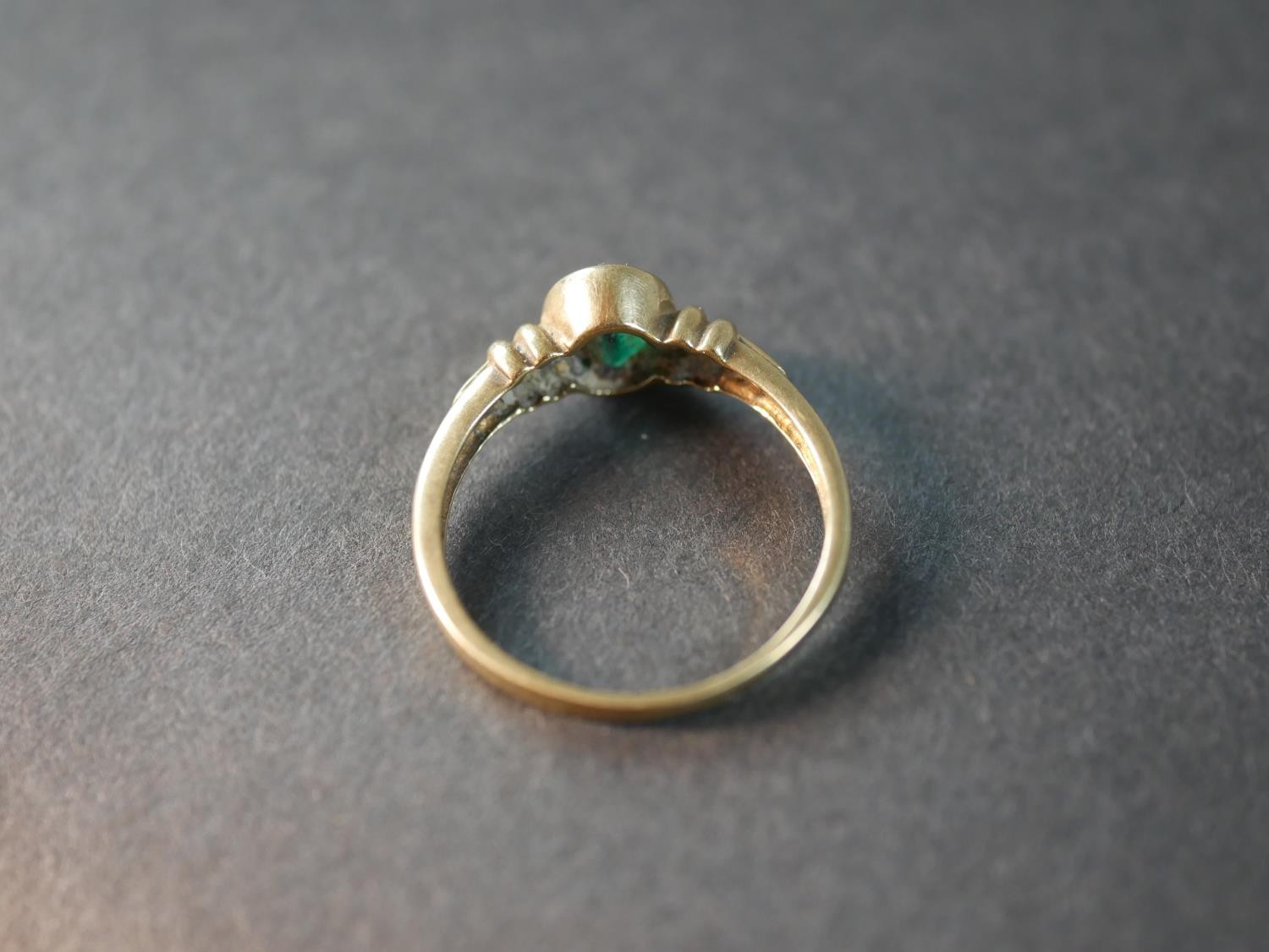 A 9 carat gold emerald paste and diamond flanked solitaire ring, set with four round eight cut - Image 3 of 5