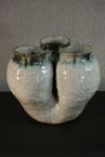 A large green and white glazed art pottery three lobed planter. (damaged) H.35 W.34cm.