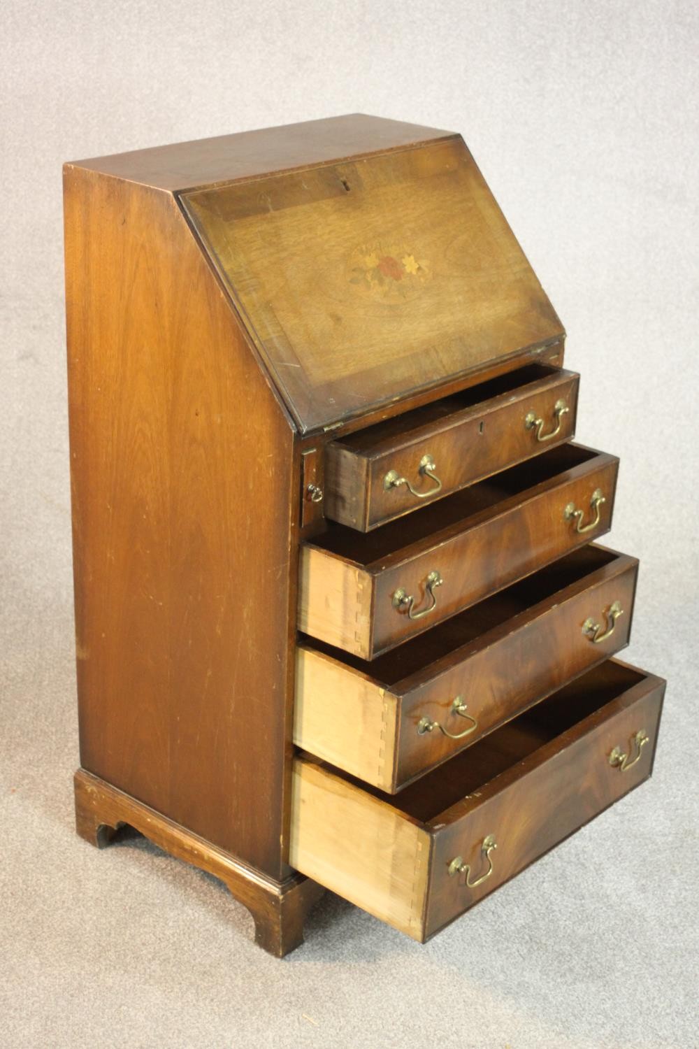 A George III style mahogany bureau, the fall front enclosing a drawer and pigeonholes, over four - Image 5 of 7