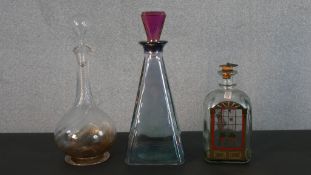 A Holmegaard Danish Advent decanter by Michael Bang along with an Italian Art Deco style decanter