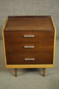 A circa 1960s Stag Furniture teak bedside chest, with a three quarter gallery over three long