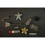A collection of antique silver brooches, including two Victorian engraved silver brooches one as