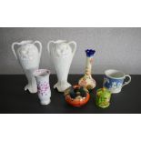A collection of porcelain and ceramics, including two Art Nouveau design twin handled vases (