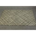 A contemporary John Lewis Croft Collection handmade Matlock rug in hues of grey, with labels to