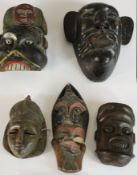 A collection of five carved and painted African Tribal masks. H.47 W.19cm. (largest)