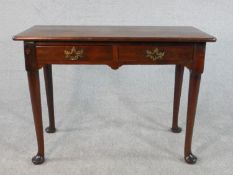 A George II mahogany side table, the rectangular top over two short drawers with brass handles and