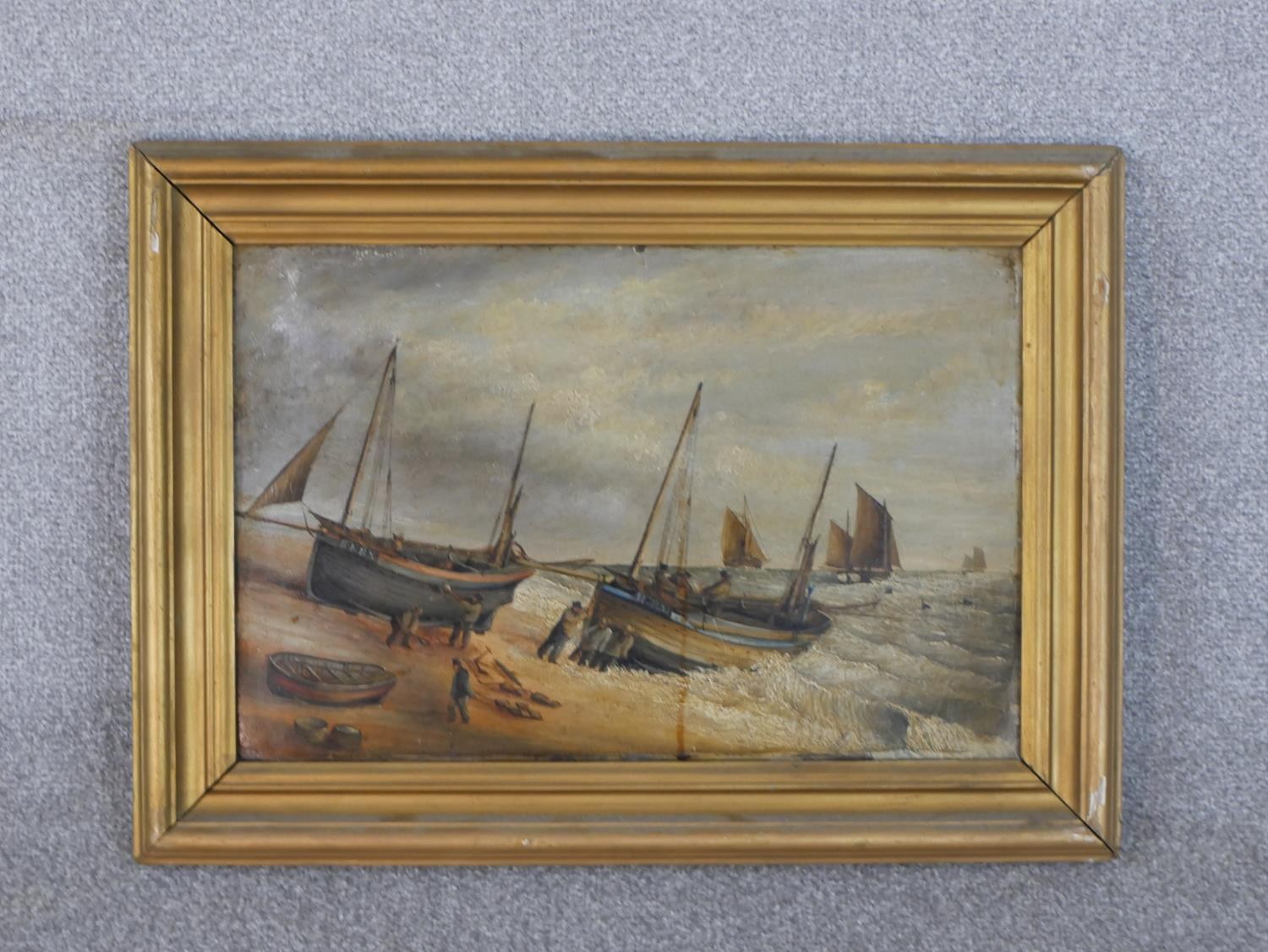 A gilt framed 19th century oil on board of fishermen pushing their boats out to sea, unsigned. H. - Image 2 of 4