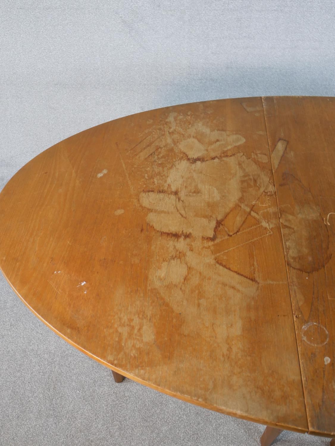 A late 20th century teak drop leaf dining table, the top of oval form with gateleg supports. H.74 - Image 5 of 5