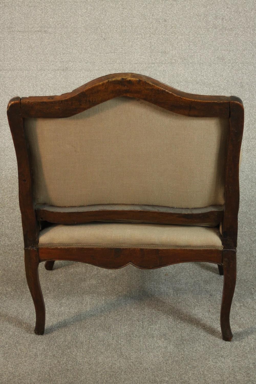 A French Louis XV provincial walnut fauteuil á la reine, with carved floral apron, cabriole legs, - Image 6 of 9