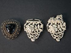 A white metal (tests as silver) early 20th century pierced nurses buckle with wild rose and