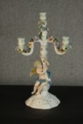 A early 20th century Ruskin hand painted porcelain cherub and floral relief design four branch