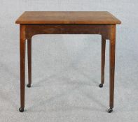 A late Victorian oak occasional table, the rectangular plank top with chamfered edges on square