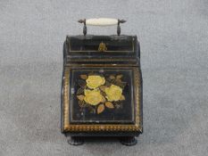 An early 20th century painted floral design toleware coal scuttle with ceramic handle. H.40 W.28 D.