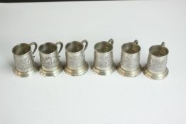 A collection of six miniature repousse Indian silver elephant tankards. Stamped Sterling Silver. H.5