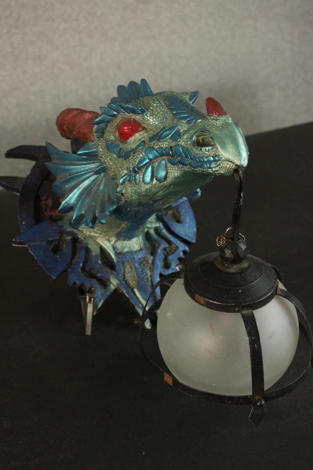 A moulded metallic painted dragon head wall lamp with caged frosted glass globe shade. H.33 W.23 D. - Image 3 of 7