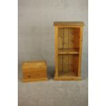A small late 20th century pine bookcase with one shelf on a plinth base, together with a small