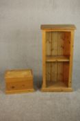 A small late 20th century pine bookcase with one shelf on a plinth base, together with a small