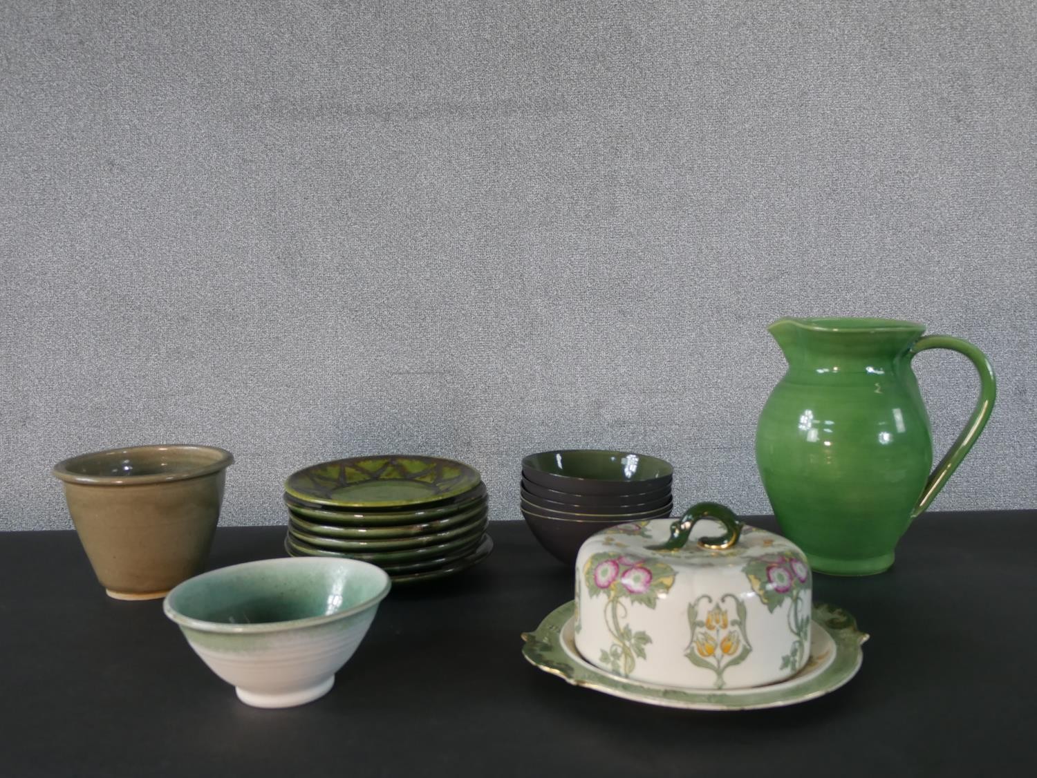 A collection of mixed studio pottery and ceramics, including a Royal Doulton Art Nouveau floral