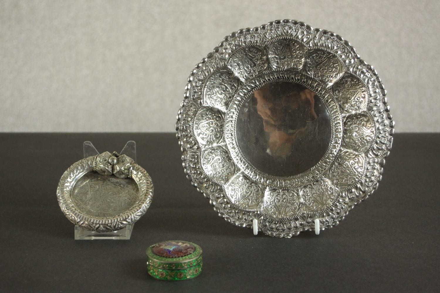 Three Oriental silver and white metal pieces, including a repousse design floral form dish on - Image 3 of 16