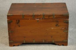 A teak and brass bound chest with fitted interior and twin carrying handles. H.47 W.78 D.46cm.