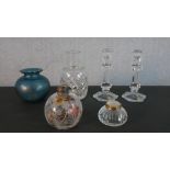 A pair of Bohemian crystal candlesticks, a silver collared engraved perfume bottle (top missing) and