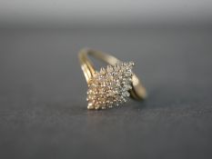 A 9 carat yellow gold and diamond cluster ring, set with thirty four round eight cut diamonds with a