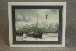 A framed and glazed watercolour of a sailing boat on the river with heron flying over,